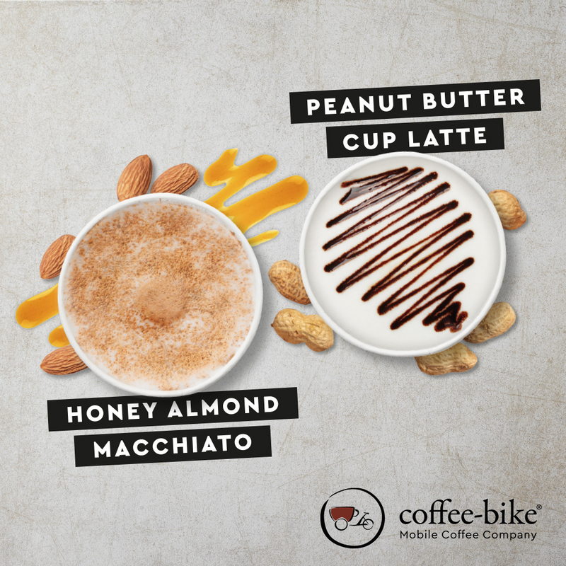 Winter Specials Honey Almond Macchiato and Peanut Butter Cup Latte on stone background with Coffee-Bike logo on bottom right side