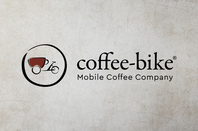 Farbiges Coffee-Bike Logo auf grauem Hintergrund mit Steintextur