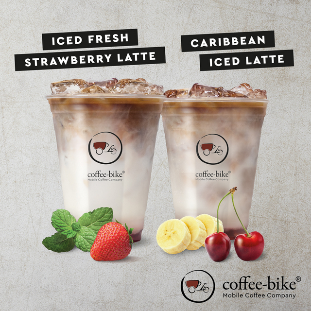 Summer Specials Iced Fresh Strawberry Latte and Caribbean Iced Latte on stone background with Coffee-Bike logo on bottom right side