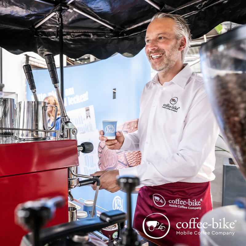 Barista with coffee cup