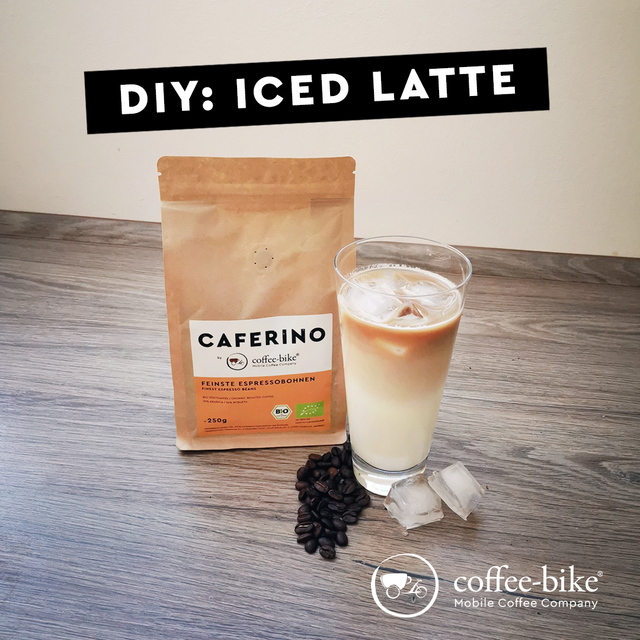 A Caferino espresso pack stands next to an Iced Latte glass with beans and ice cubes in front of it, above it black bar with the words DIY Iced Latte in white letters