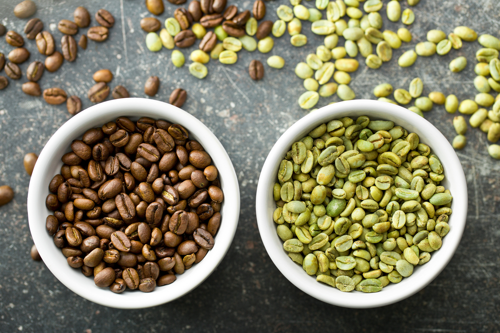 Green and roasted coffee beans illustrating how decaffeinated coffee is made from raw beans.