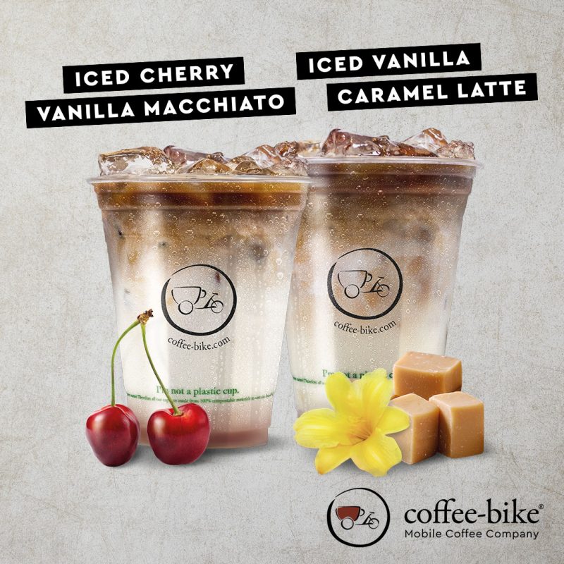 Summer Specials Iced Cherry Vanilla Macchiato and Iced Vanilla Caramel Latte on stone background with Coffee-Bike logo on bottom right side